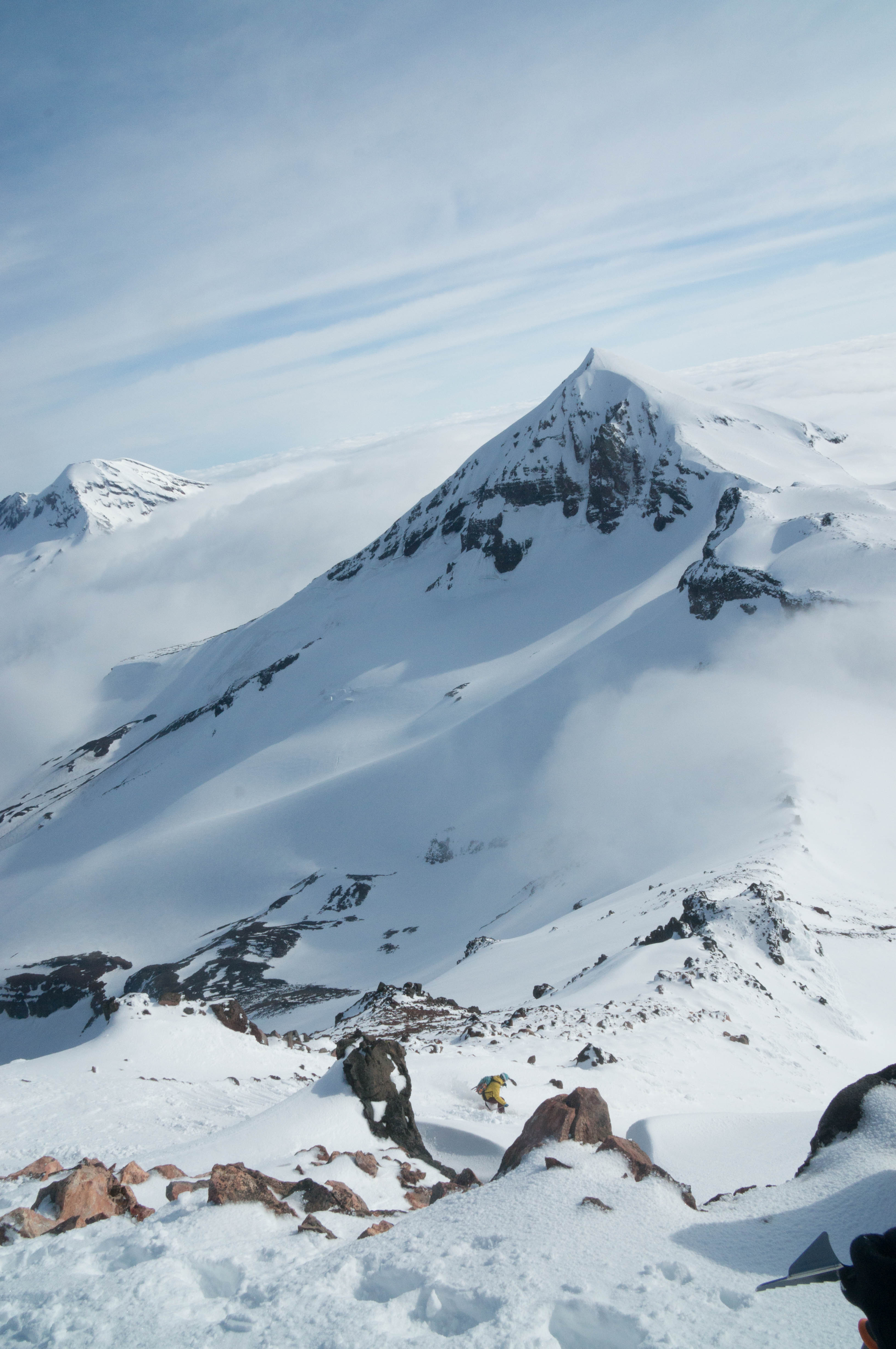 Here's Phil dropping back down the SE ridge on the North. Middle and South Sister look on in the background.